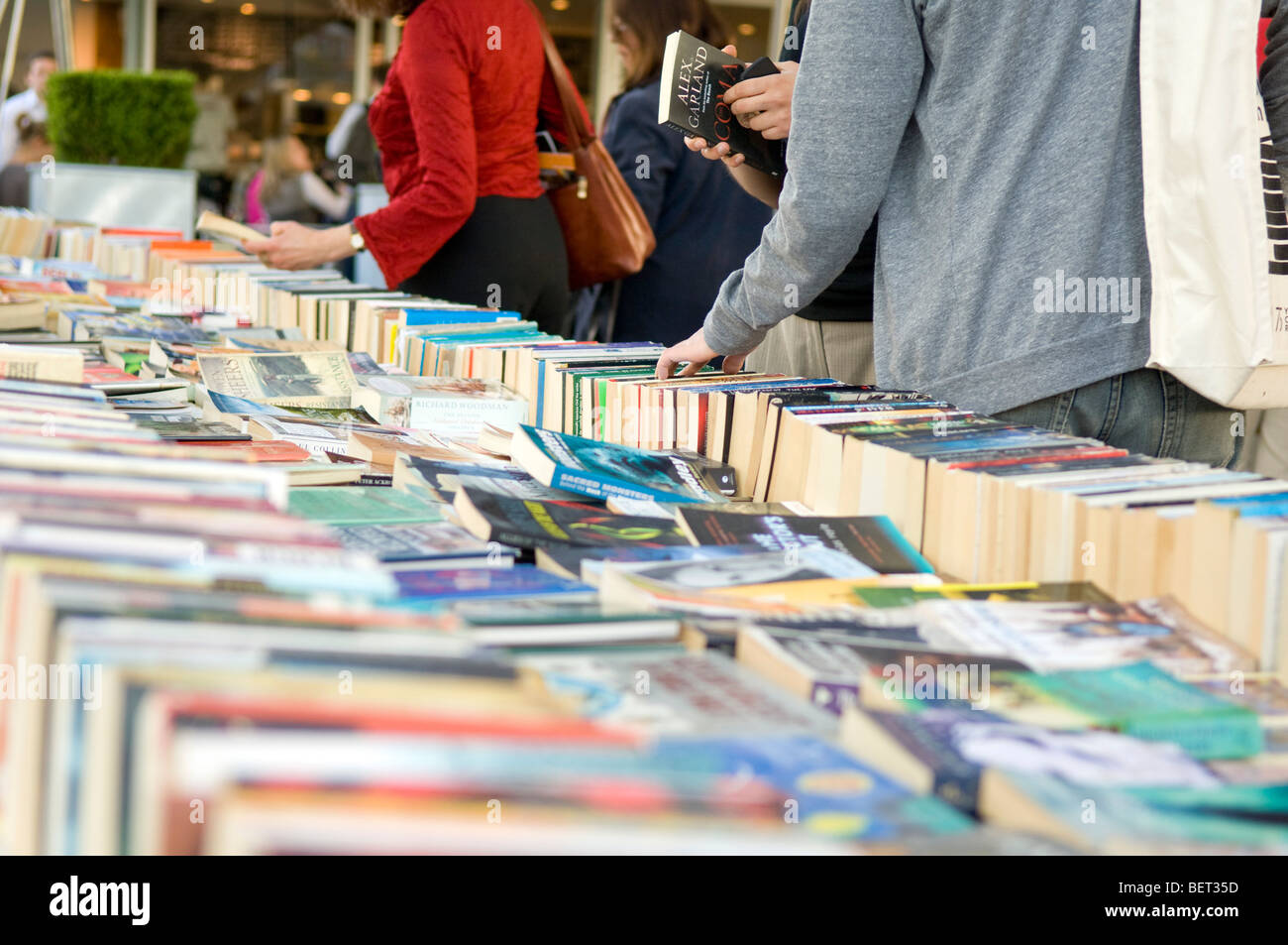 People browsing second hand books Waterloo Bridge, London Stock Photo