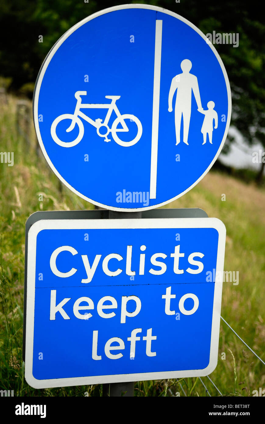 Cyclists Keep Left road sign - blue Stock Photo