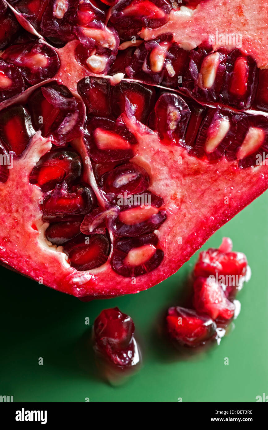 Pomegranate cut in half showing seeds Stock Photo