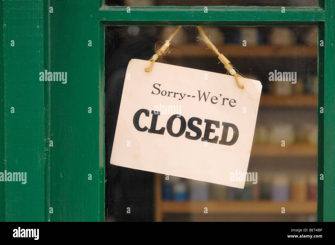 Sorry We're Closed sign hanging in a shop window Stock Photo