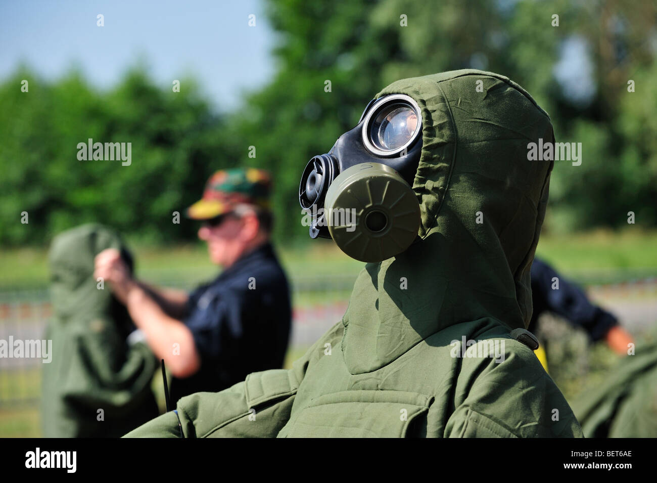 Soldier equipped with with gas mask and chemical warfare protection clothing at airshow in Koksijde, Belgium Stock Photo