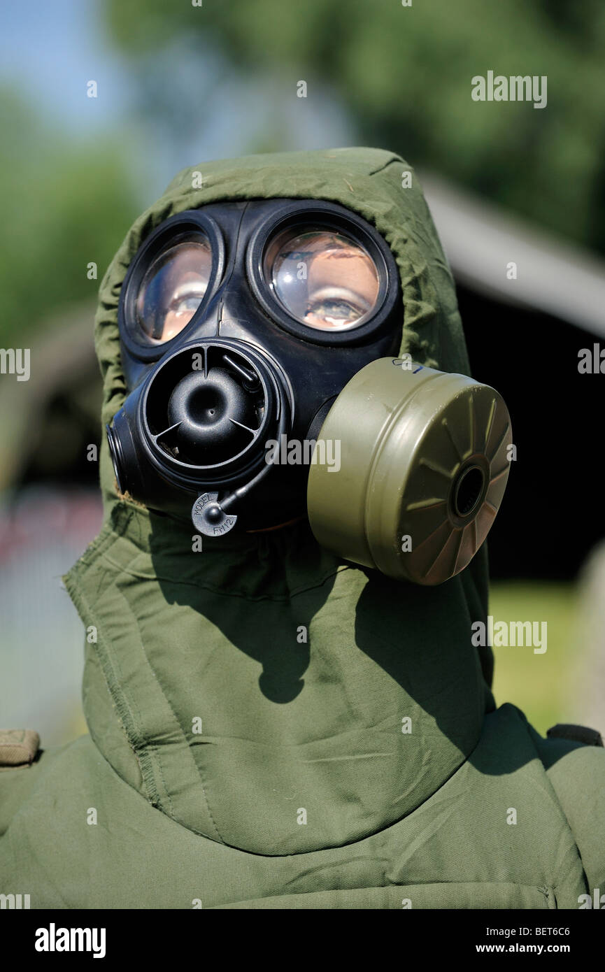 Soldier equipped with with gas mask and chemical warfare protection clothing at airshow in Koksijde, Belgium Stock Photo
