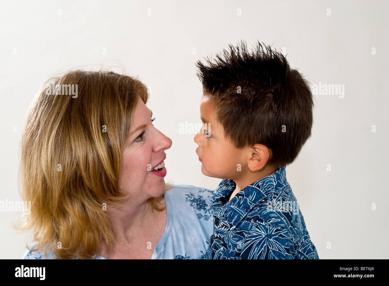 Series of images of a single mom holding her newly adopted 3 year old Hispanic foster son. California MR  United States Stock Photo