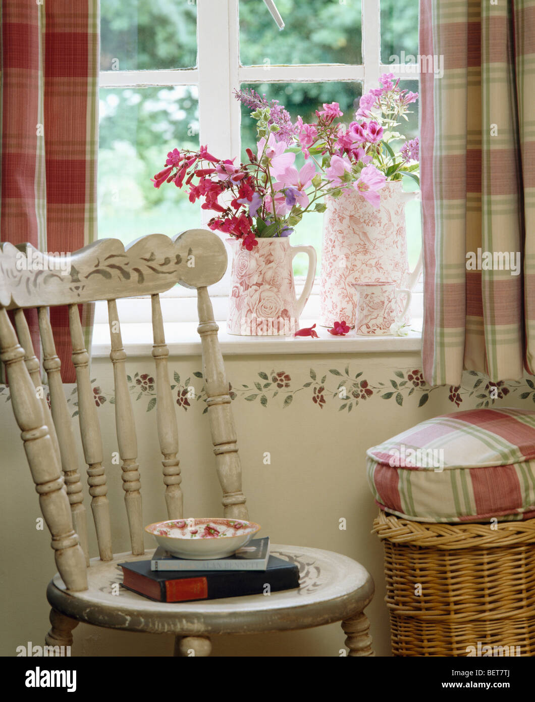 Painted White Chair In Front Of Window With Pink Flowers In Pink