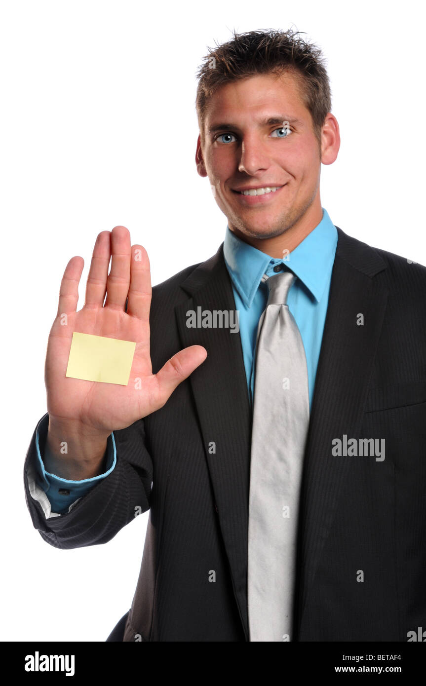 Businessman with adhesive note on hand isolated over white - Selective focus on hand Stock Photo