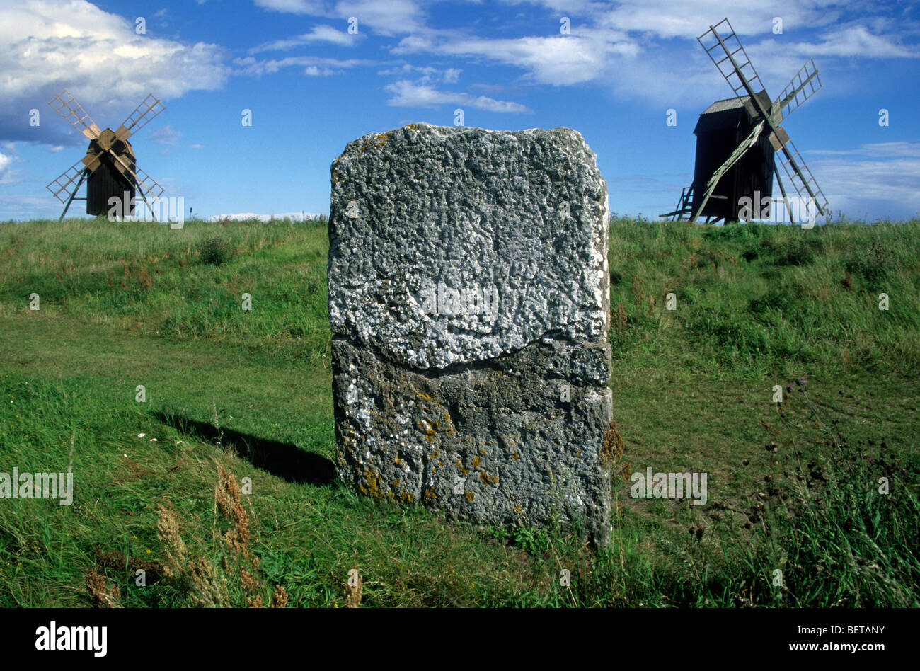 Standing stones and windmills at burial ground, Oland, Sweden Stock Photo