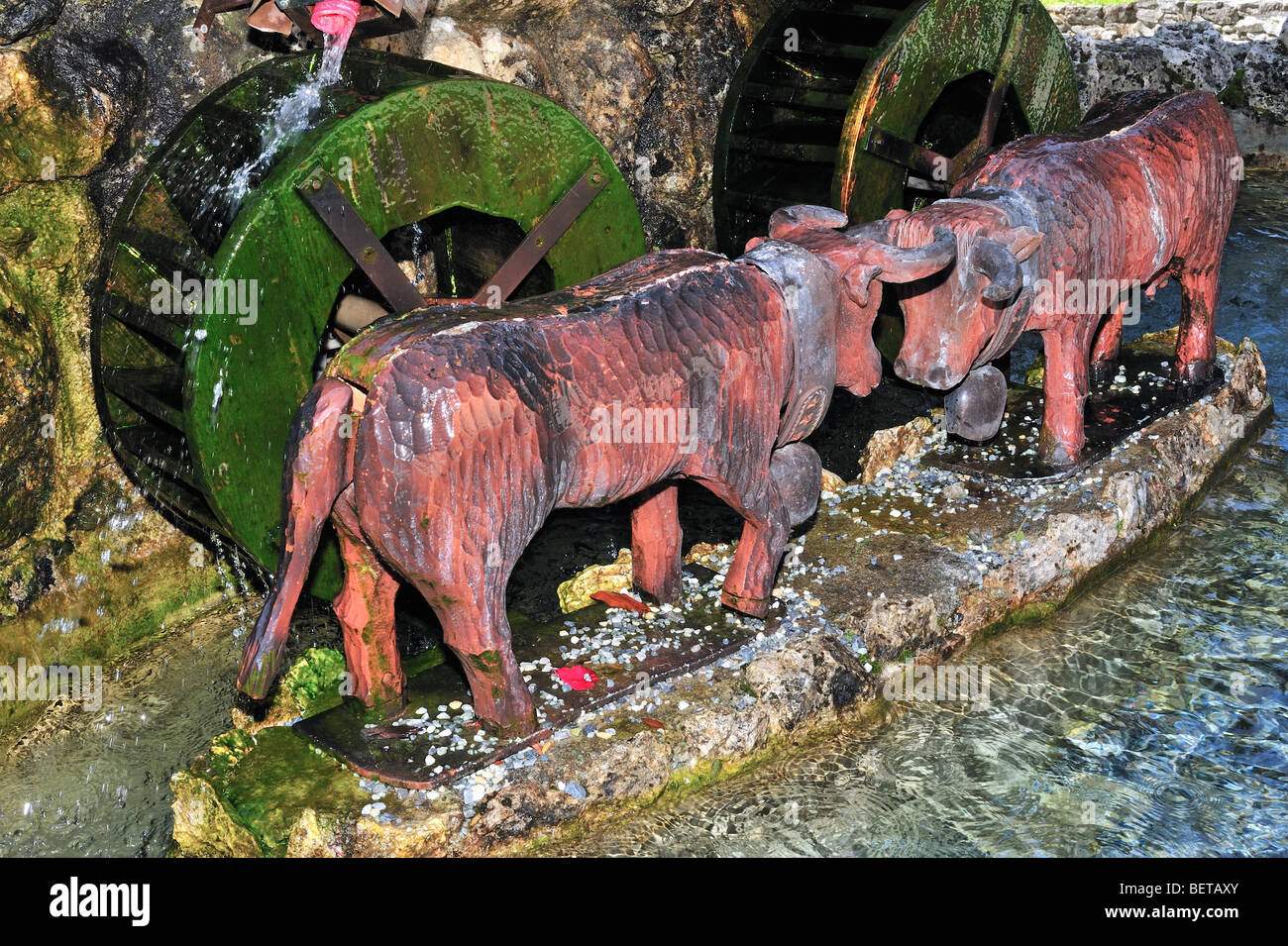 Swiss sculpture / fountain Combat des Reines / Cow Fight in the Alpine village Grimentz, Valais / Wallis, Switzerland Stock Photo