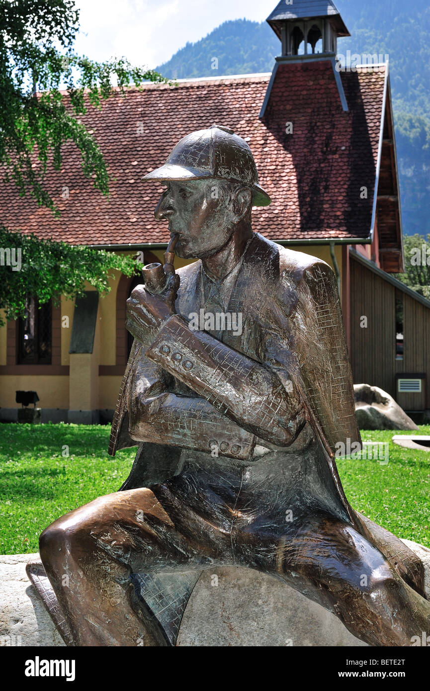 Statue of Sir Arthur Conan Doyle's character Sherlock Holmes outside the English Church at Meiringen, Bern, Switzerland Stock Photo