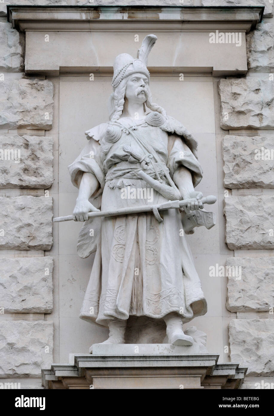 Vienna, Austria. Heldenplatz. Stone statue on the facade of the Neue Burg: Magyar / Hungarian soldier (by Rudolf Weyr) Stock Photo
