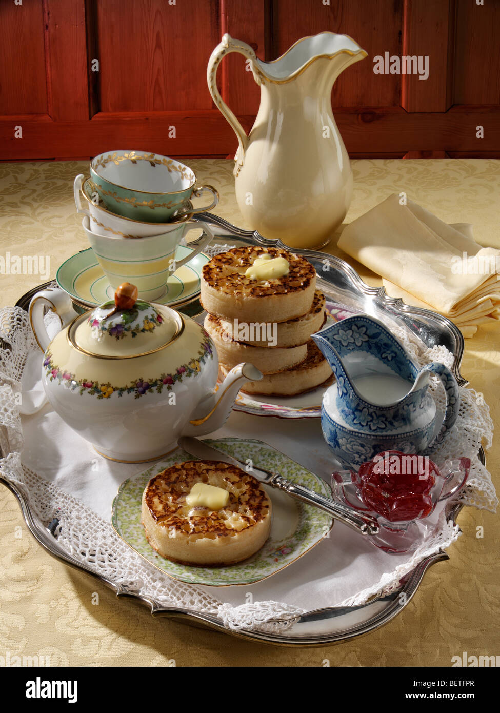 Buttered crumpets in an afternoon tea setting Stock Photo Alamy