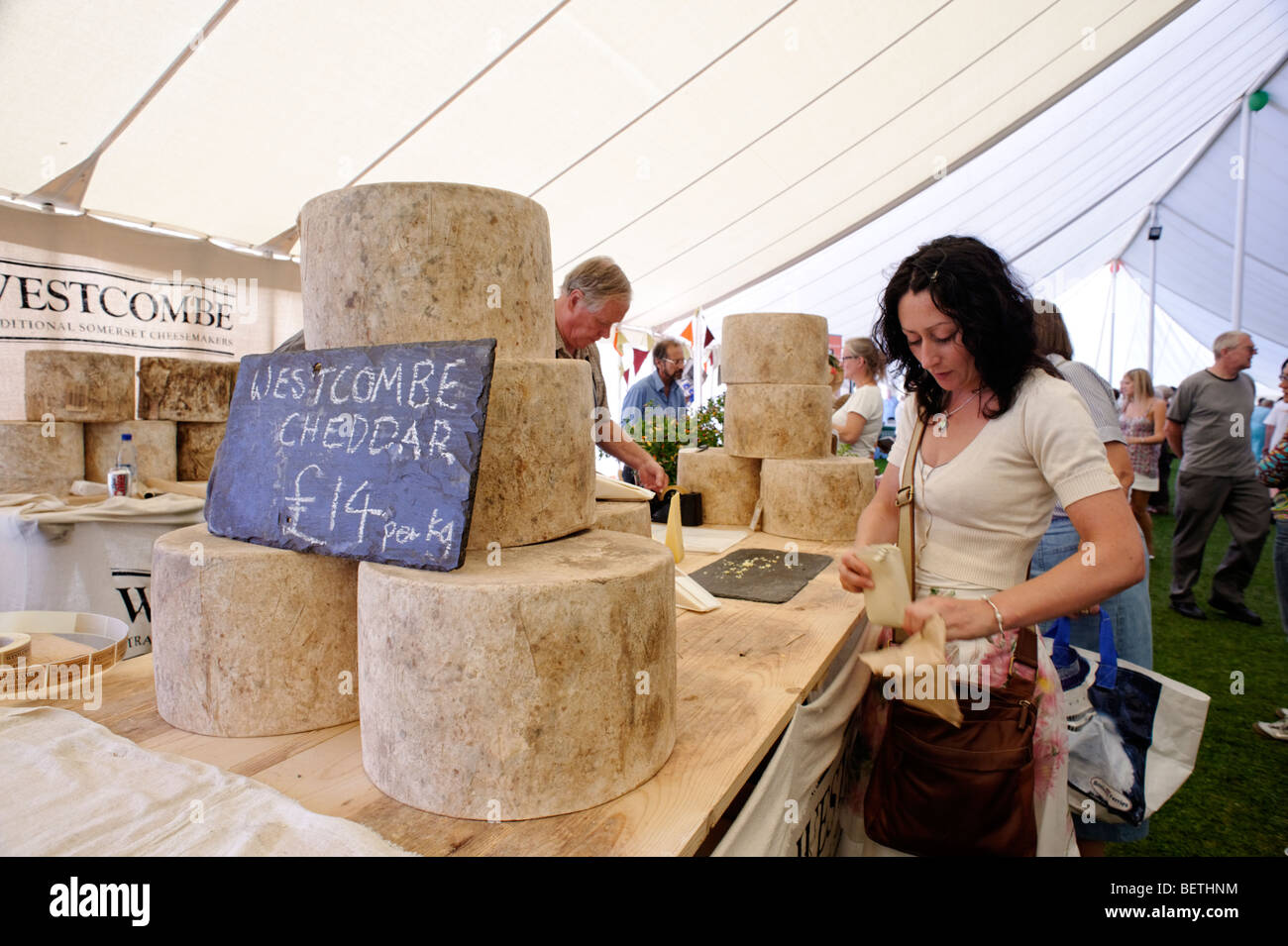 Large rounds of traditional farmhouse cheddar cheese at a west country