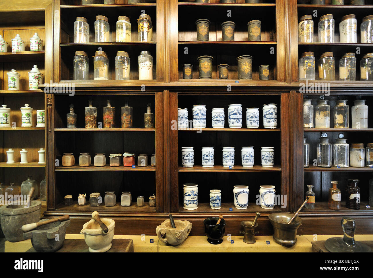 Apothecary cabinet of old pharmacy showing pots and jars with medicines in the Orval Abbey / Abbaye Notre-Dame d'Orval, Belgium Stock Photo