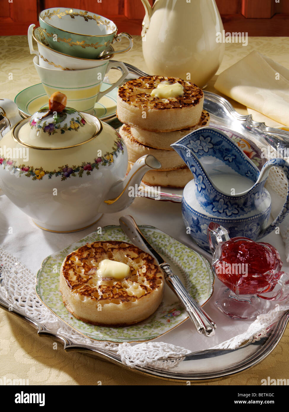 Buttered crumpets in an afternoon tea setting Stock Photo Alamy