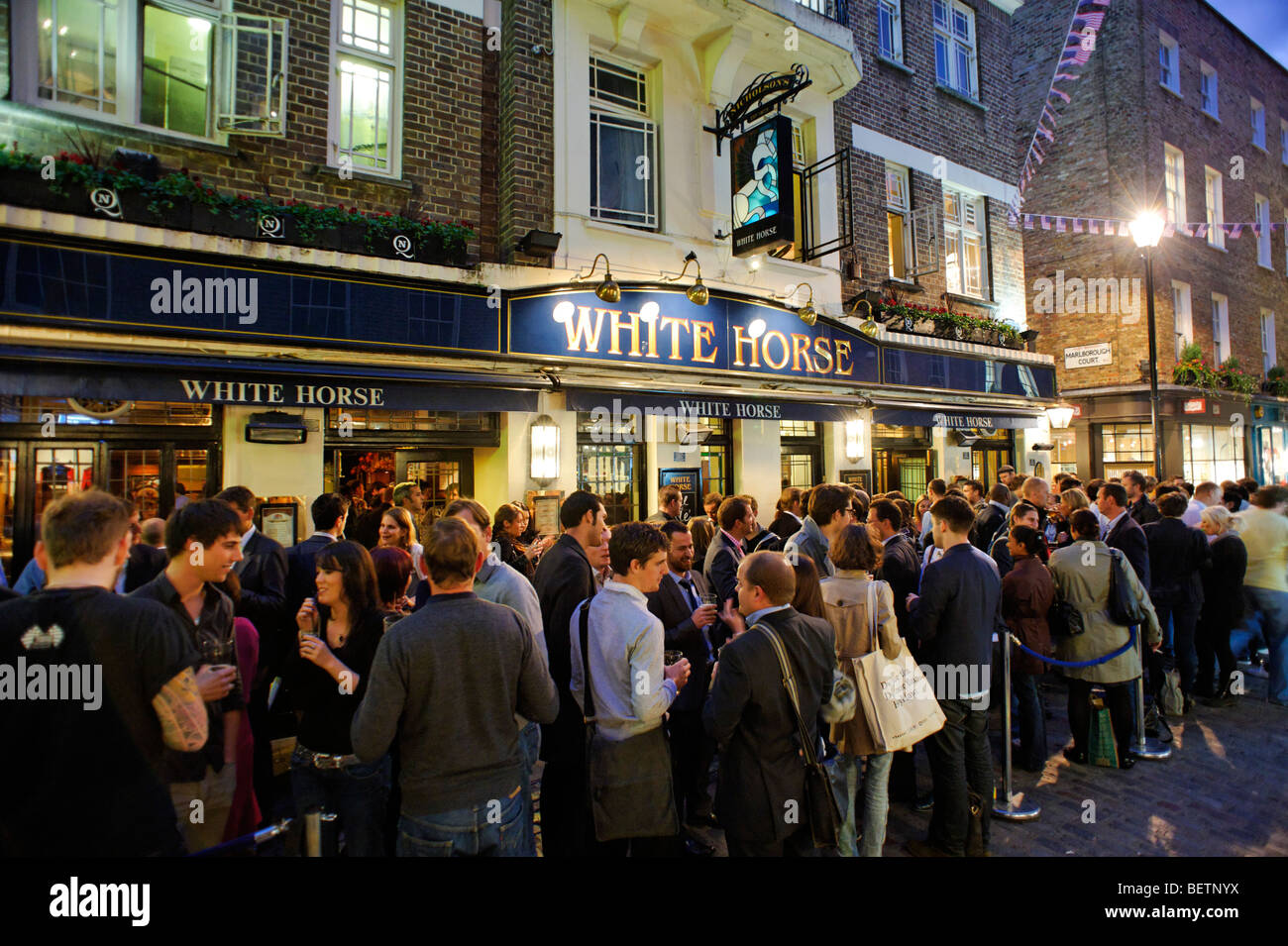 People drinking outside the White Horse pub. Soho. London. Britain. UK Stock Photo