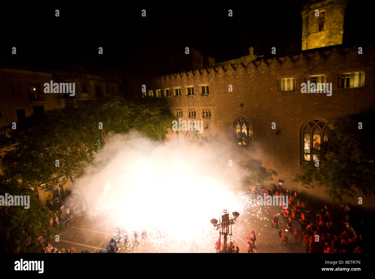 People doing the Catalan tradition corefoc at the plaza Sant Pere in Barcelona. Stock Photo