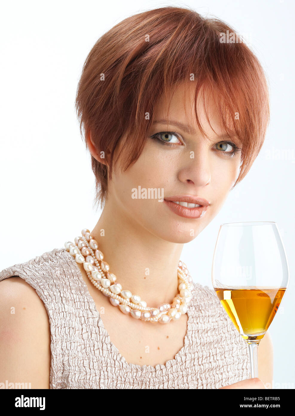 Young woman drinking glass of ice wine Stock Photo Alamy