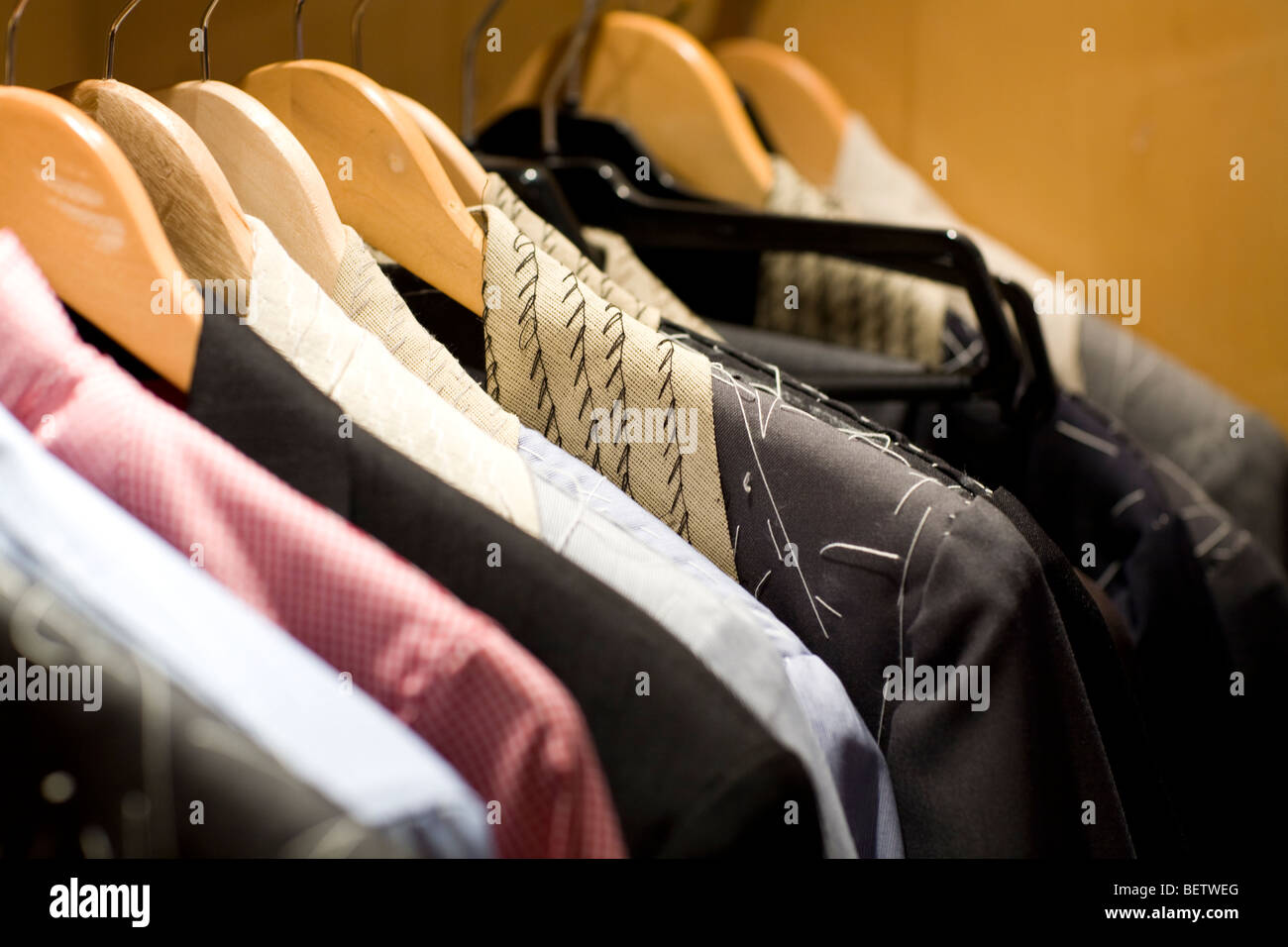 Tailored suits hang up in a tailor store Stock Photo Alamy