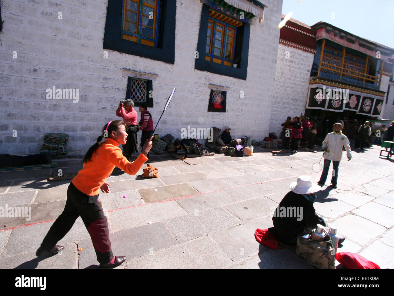 Local Tibetan kids playing badminton just outside the walls of Jokhang