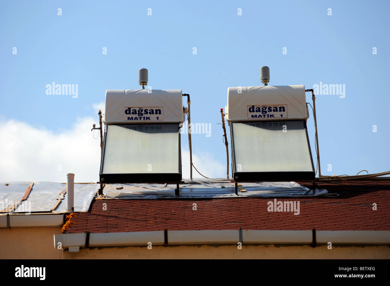Two solar powered water heaters on the roof of a villa in Kalkan Stock Photo