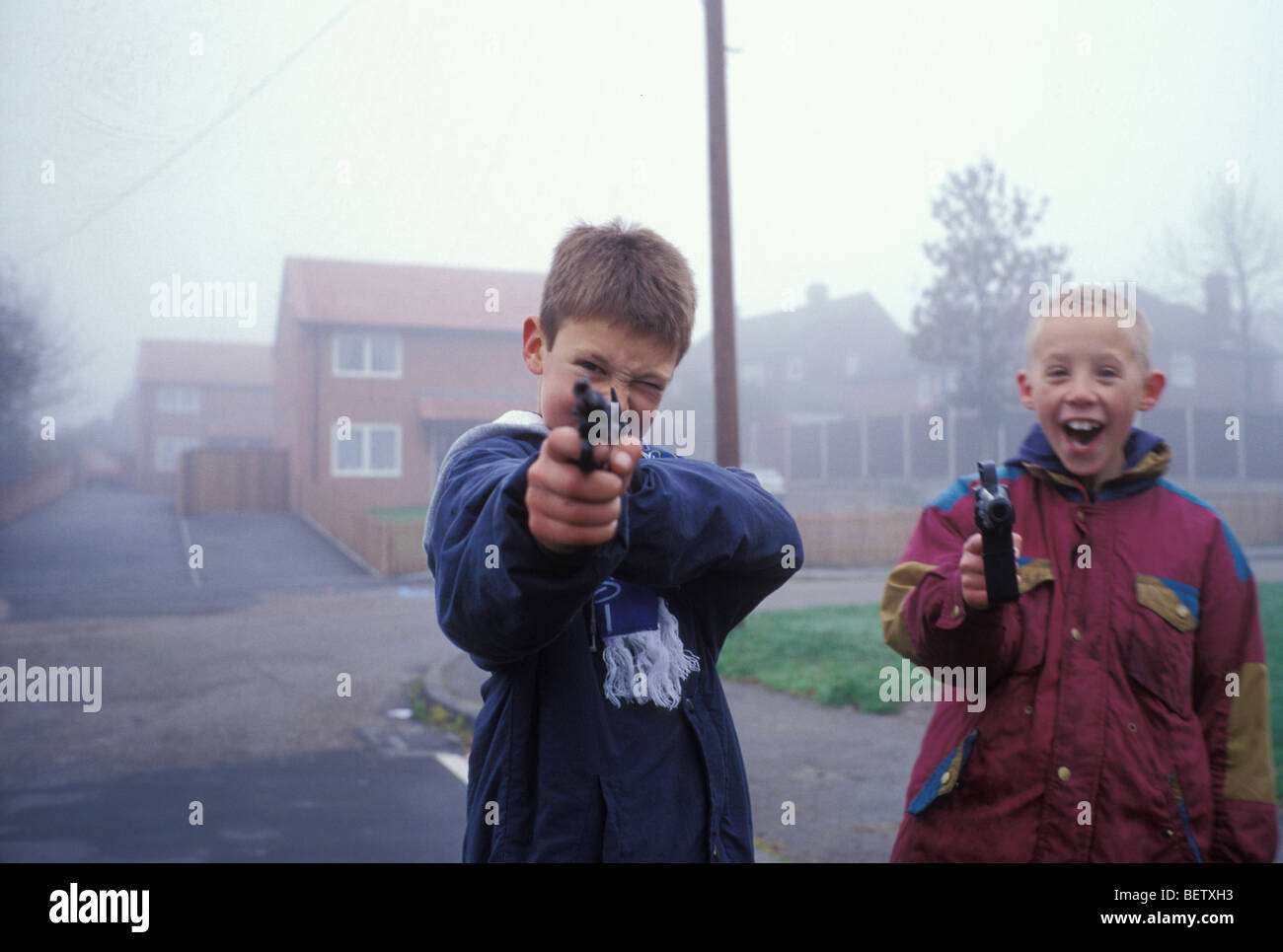 children playing with toy guns in Manton, Nottinghamshire, United Kingdom Stock Photo