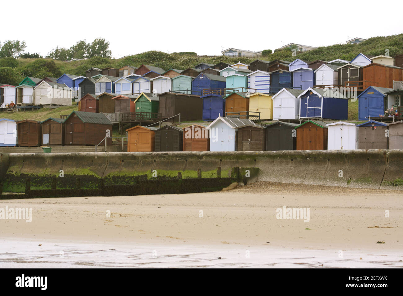 English seaside resort in winter cold grey day beach huts deserted Stock Photo