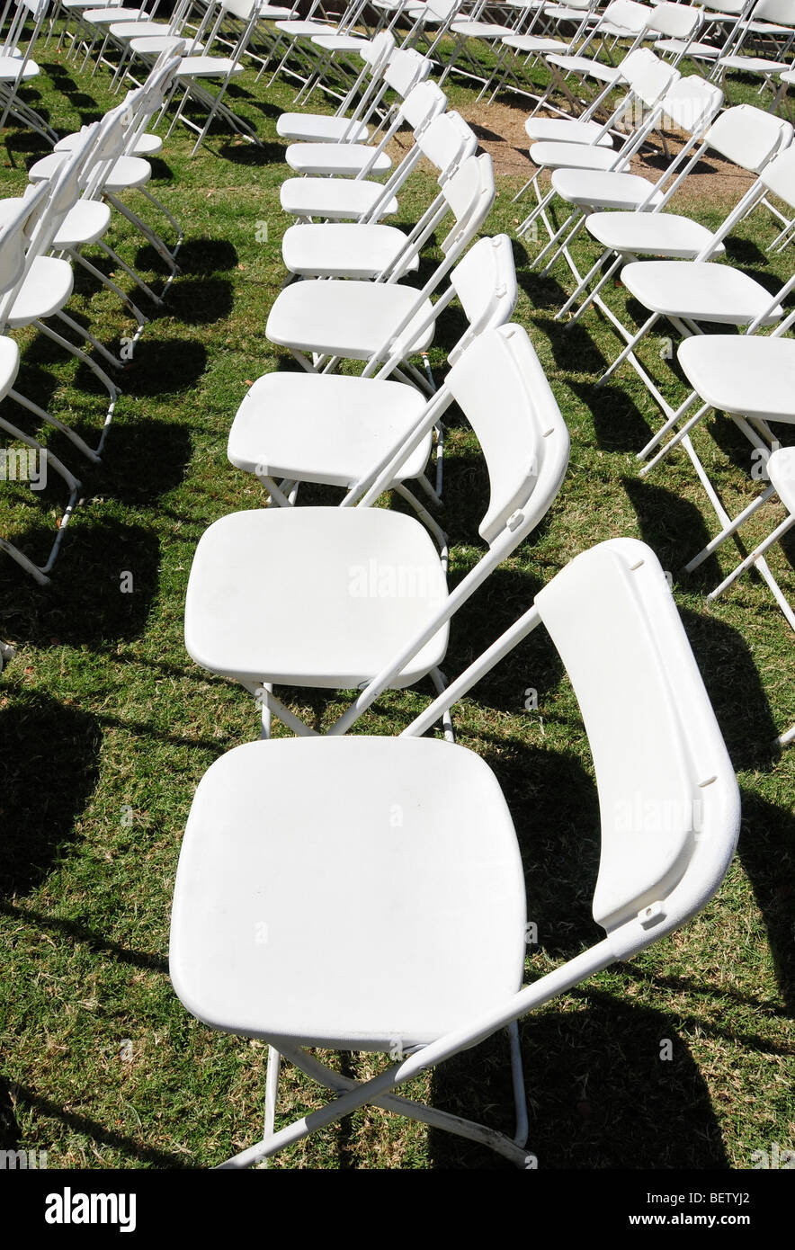 Empty folding chairs on a lawn Stock Photo Alamy
