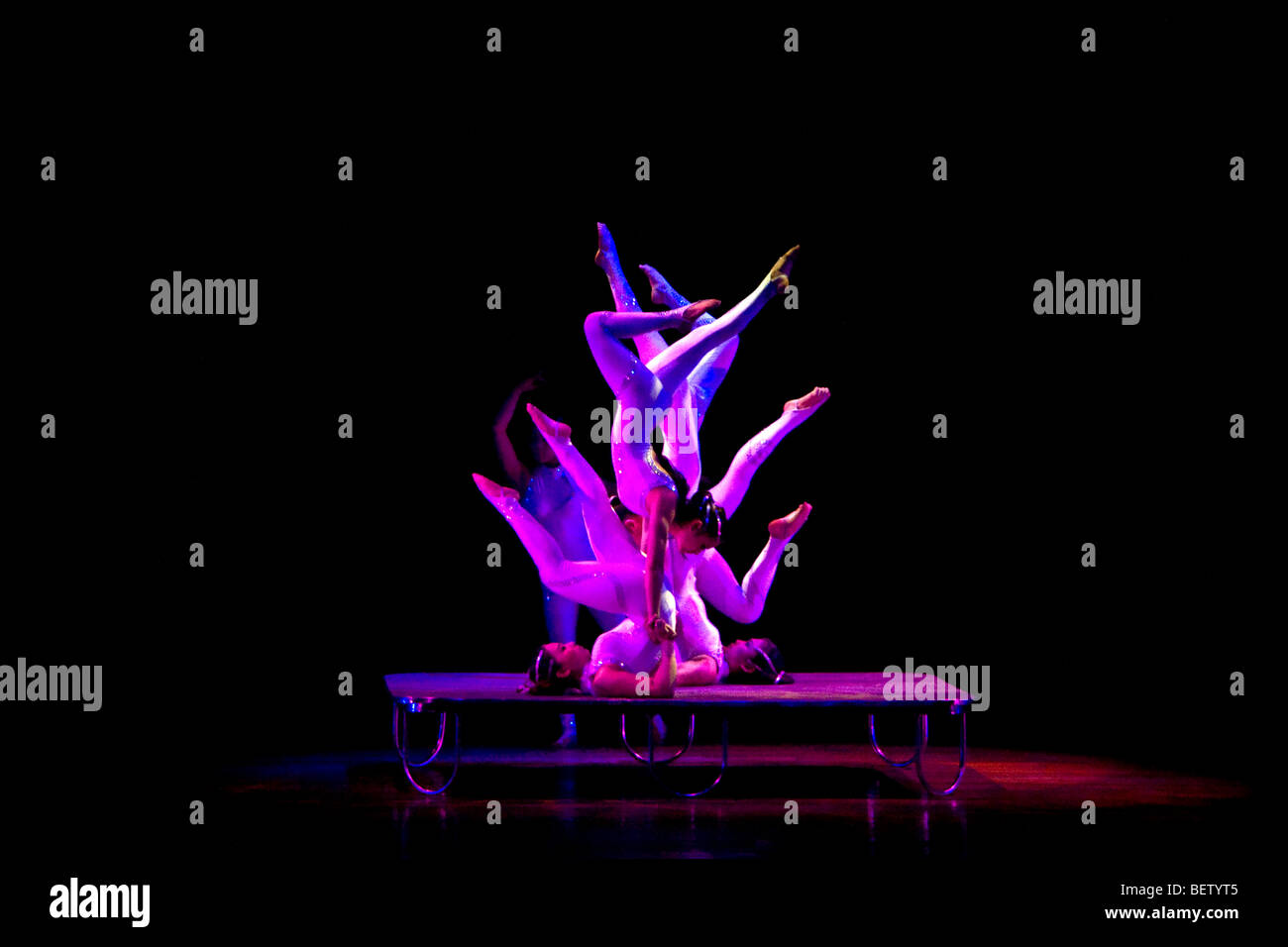 Chinese acrobats forming a flower figure Stock Photo