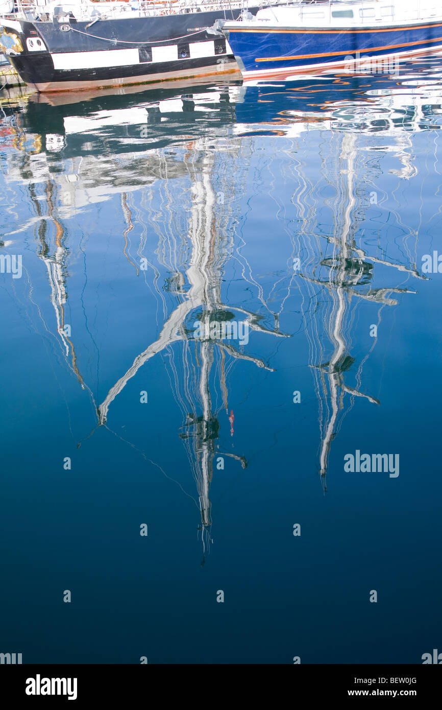 sail boats reflected in water Stock Photo - Alamy
