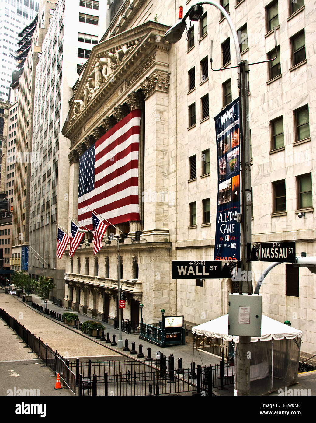 The facade of the 'New York Stock Exchange' with the 'American Flag' on 'Wall Street' in 'New York City,' 'New York.' Stock Photo