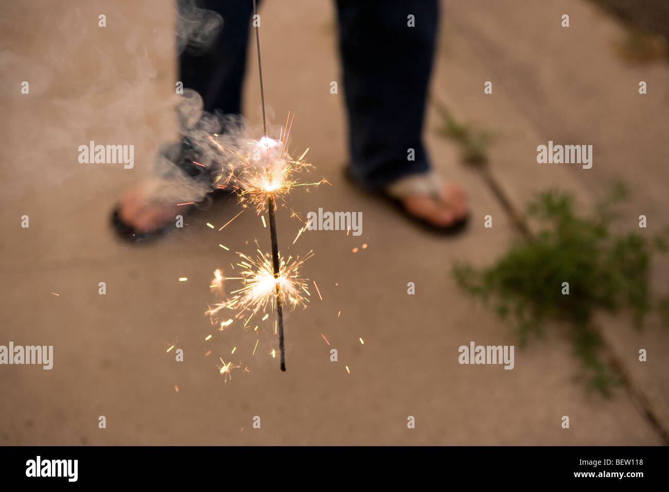 lit sparkler, Fourth of July Stock Photo