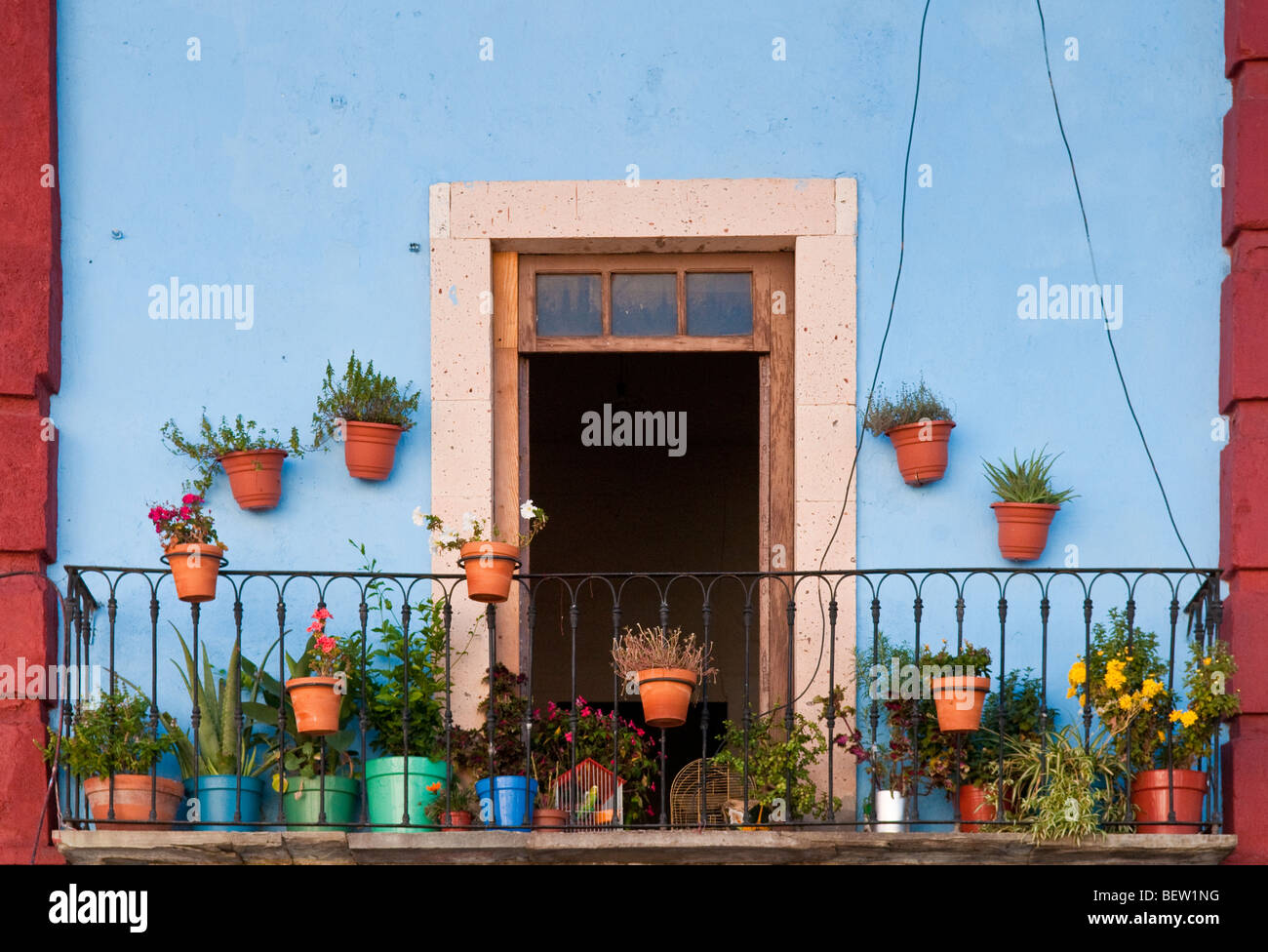 Flower pots on balcony of apartment in downtown Guanajuato, Mexico. Stock Photo