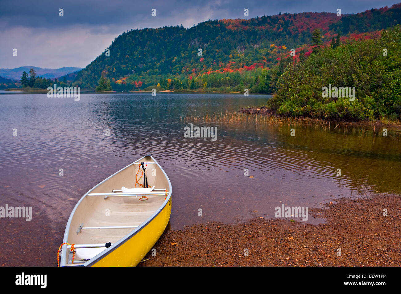 Canoe on the shore of Lac Monroe during fall in Parc national du Mont