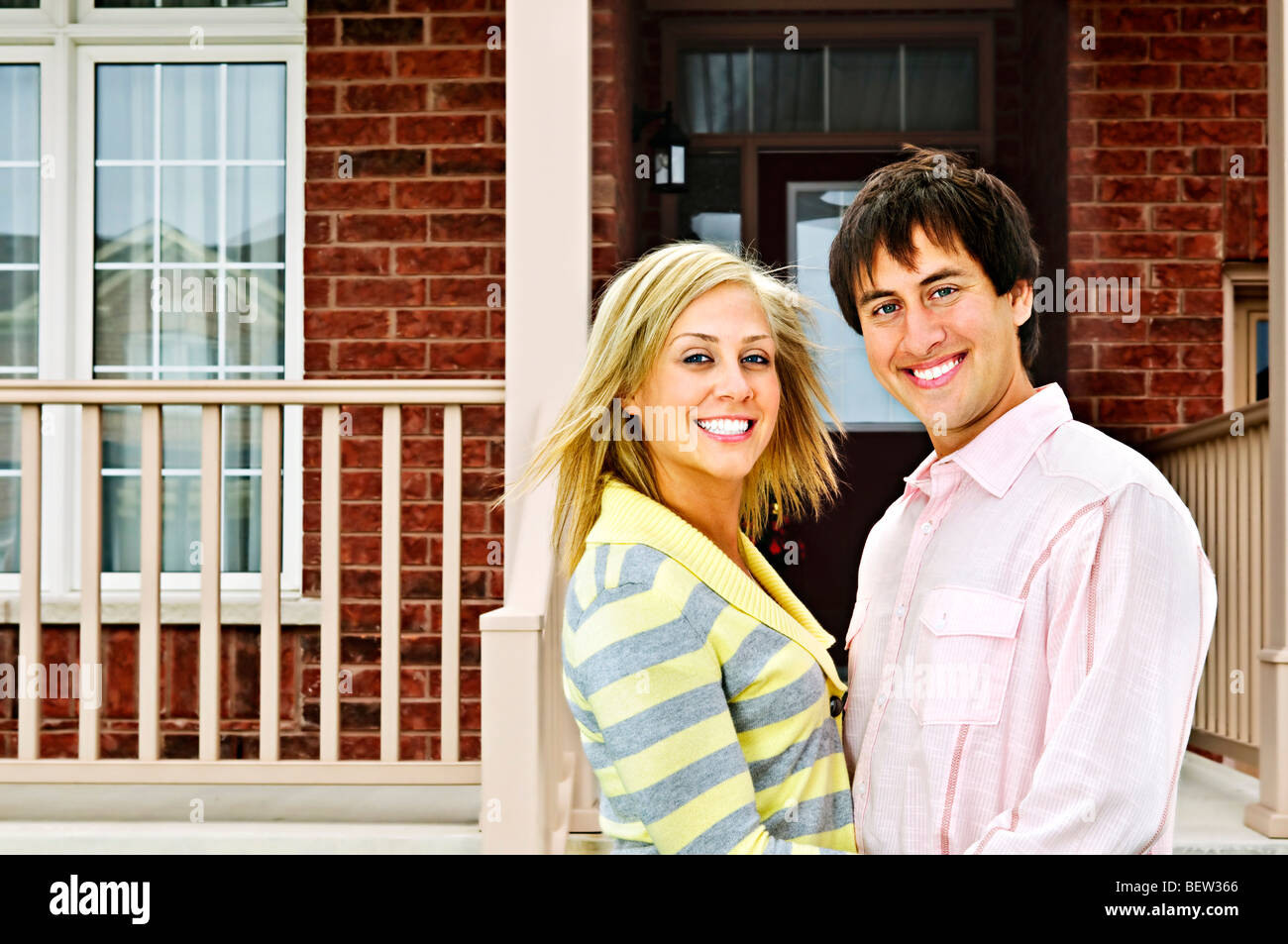 Young happy couple in love at home Stock Photo - Alamy