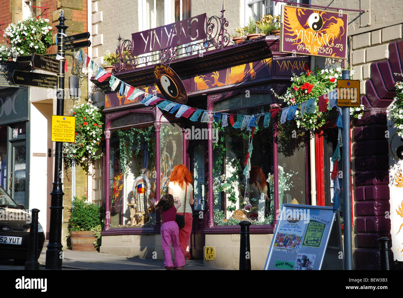 Colourful shop front in Glastonbury High Street Somerset England Stock Photo