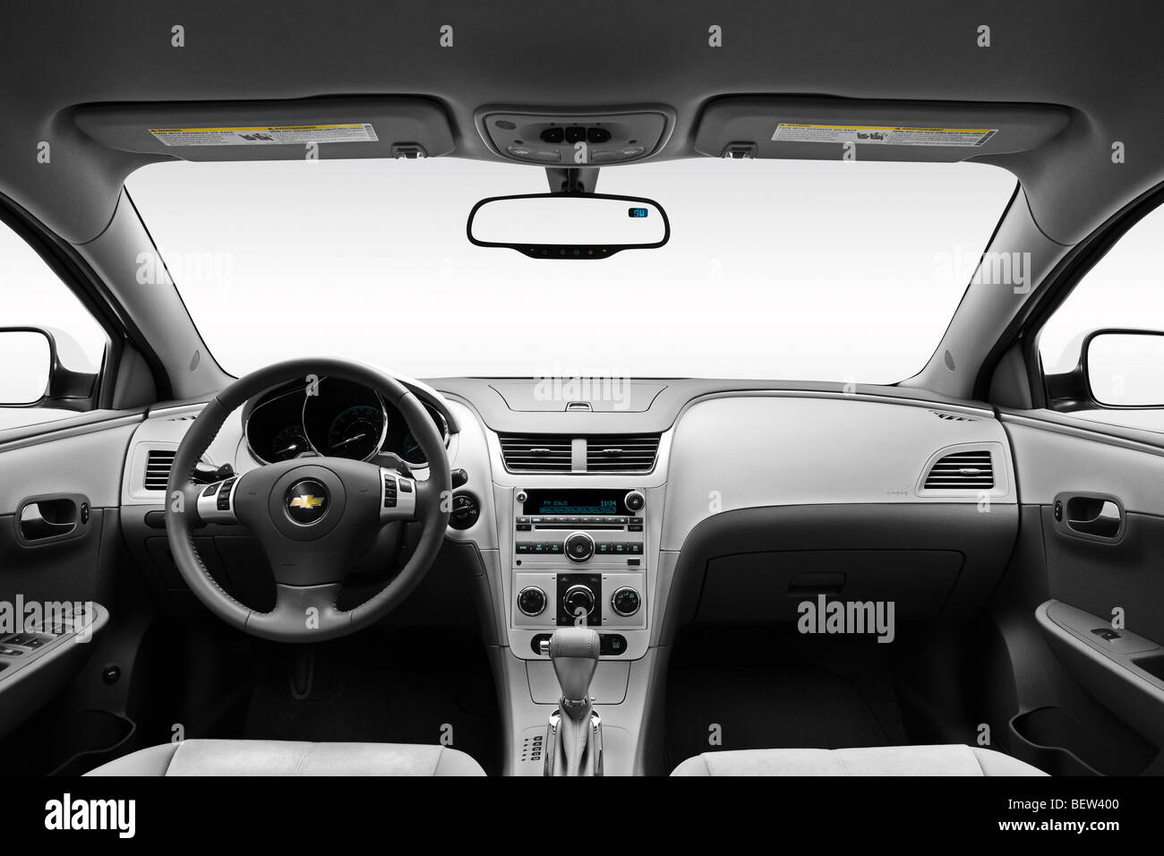 2010 Chevrolet Malibu 2LT in White - Dashboard, center console, gear shifter view Stock Photo