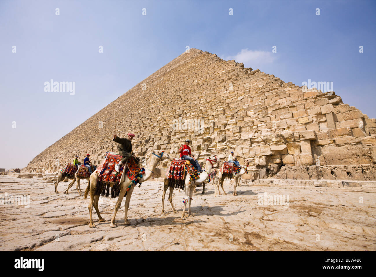 Camel Driver in Front of Pyramid of Cheops, Cairo, Egypt Stock Photo