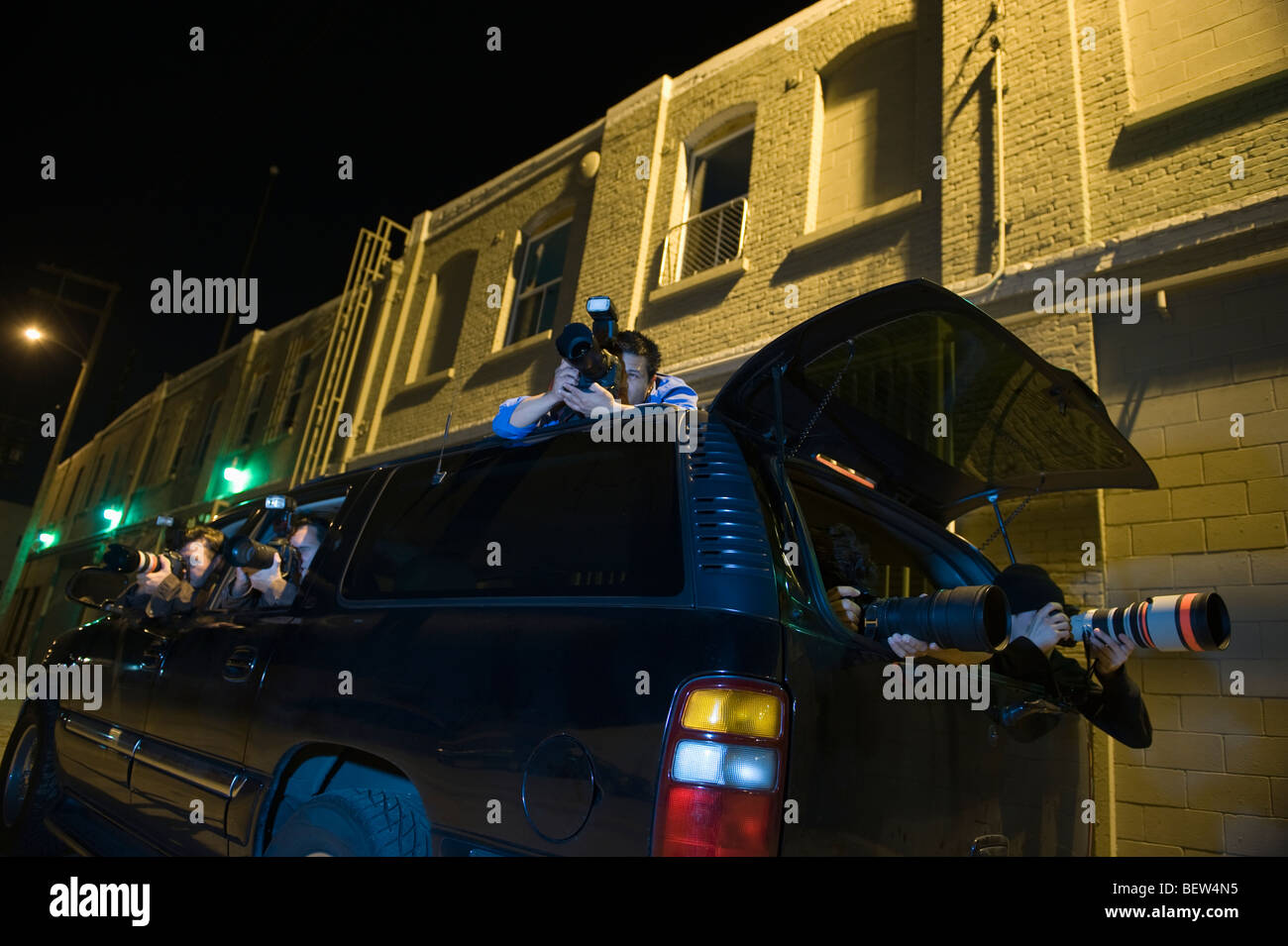 Paparazzi photographer in car Stock Photo