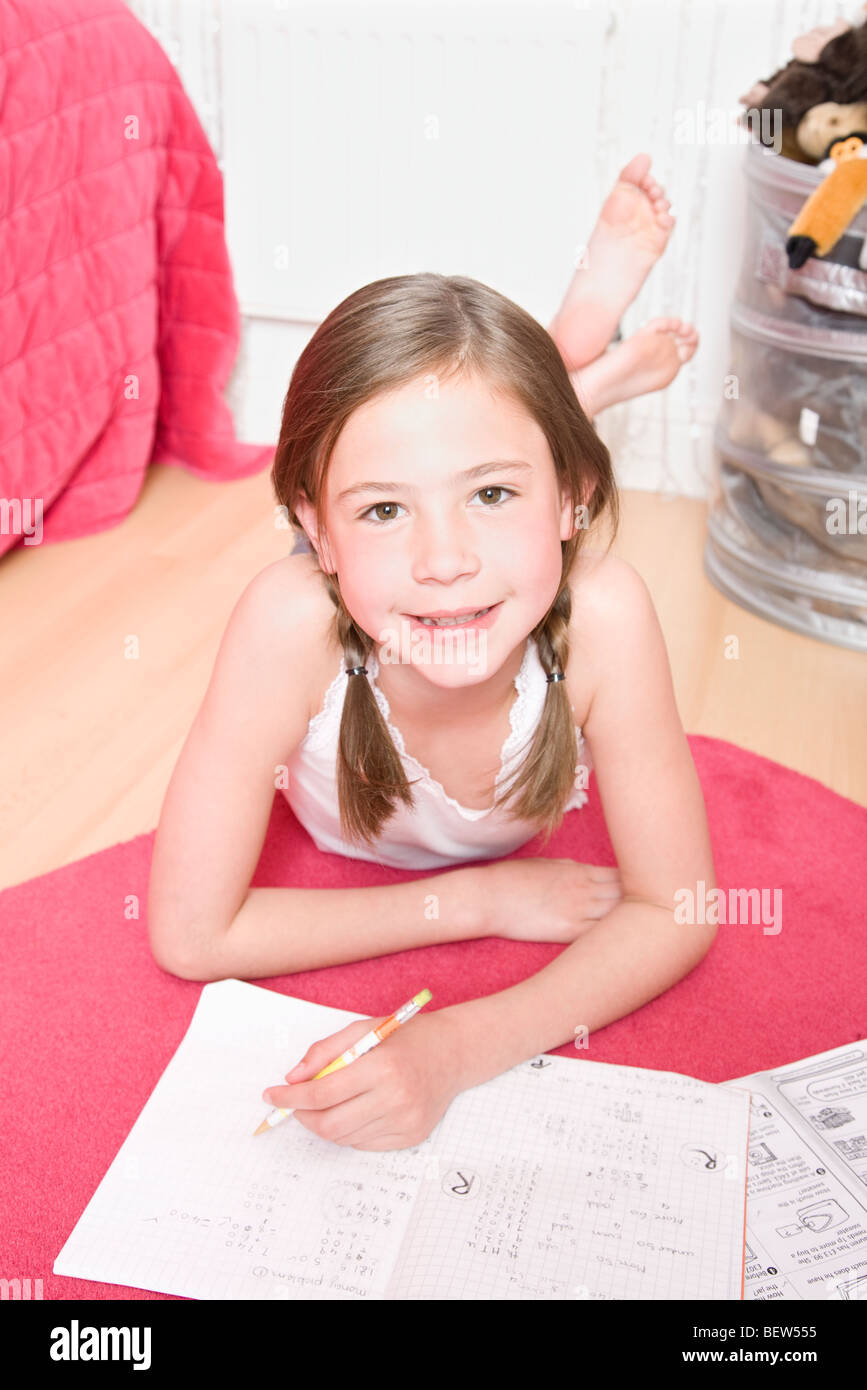 Young girl doing homework Stock Photo Alamy