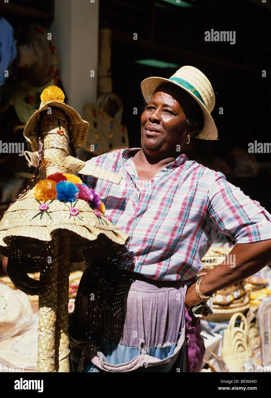 Local woman selling tourist souvenirs at the Straw Market in Nassau, the capital of The Bahamian Islands Stock Photo