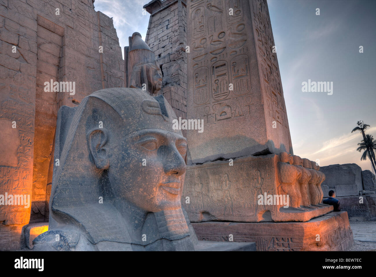 Illuminated Entrance of Luxor Temple with Ramesses II Statue and Obelisk, Luxor, Egypt Stock Photo