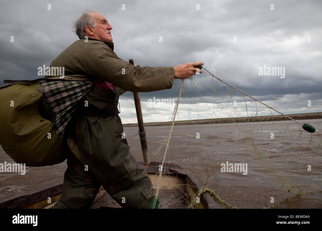 Commercial salmon fisherman with net on the River Ribble Uk Stock Photo