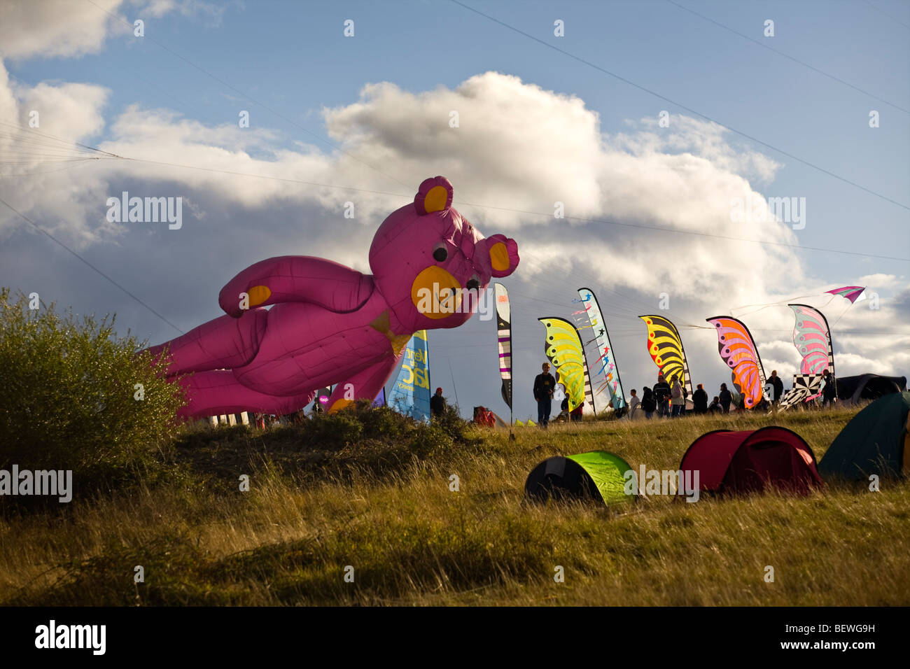 A teddy bear-shaped kite, at the time of the 'Cervolix' Air Festival (Auvergne - France). Cerf-volant en forme d'ours (France). Stock Photo