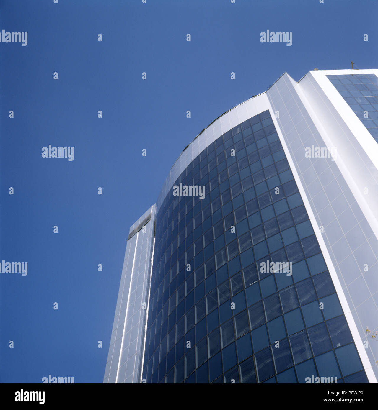 Modern building taken against a brilliant blue sky Stock Photo - Alamy