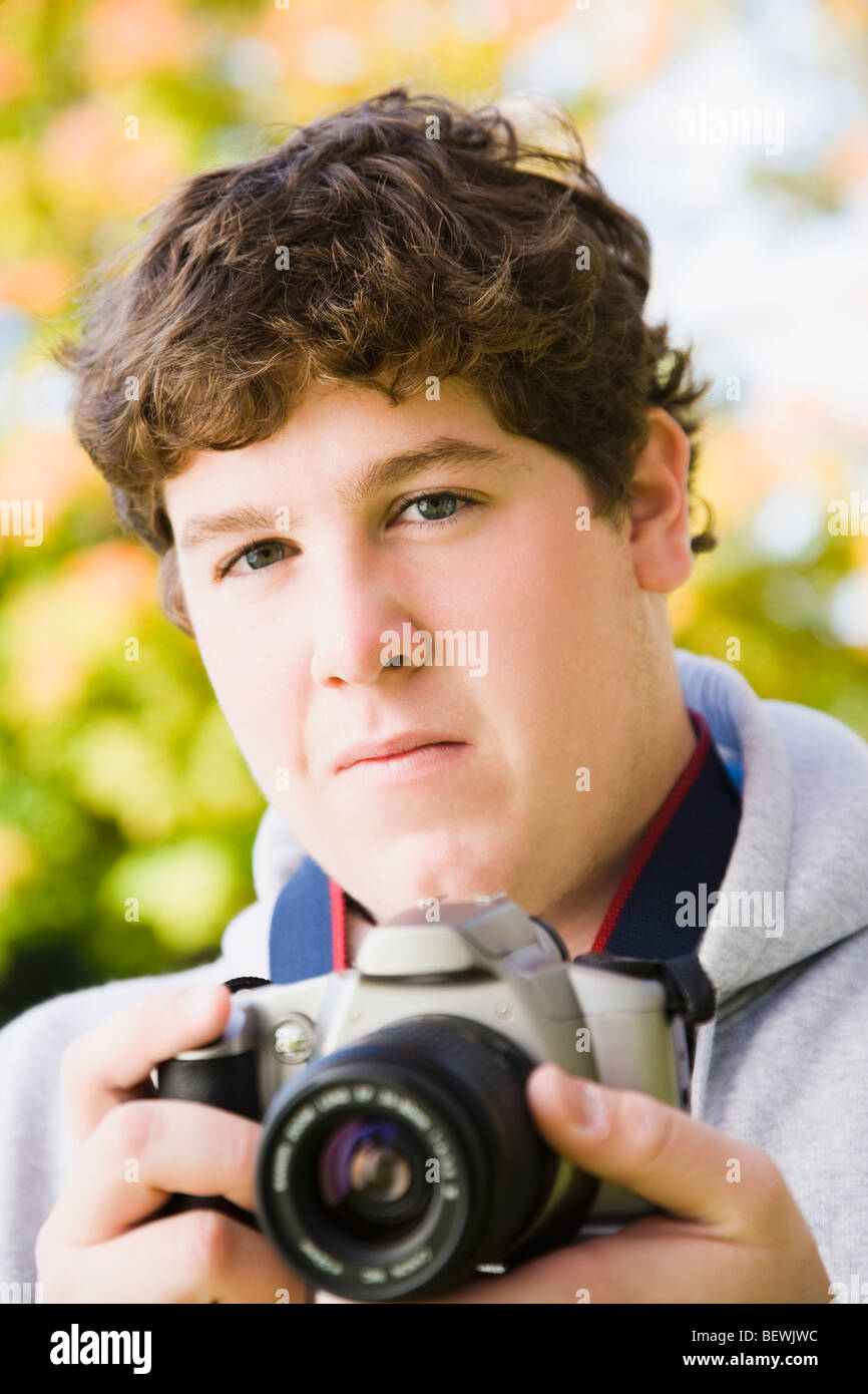 Student holding a digital camera Stock Photo - Alamy