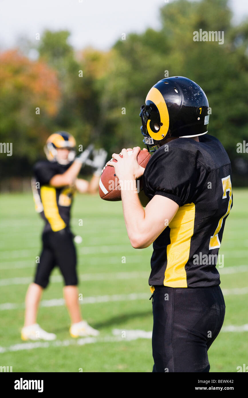 Football players playing in a field Stock Photo Alamy