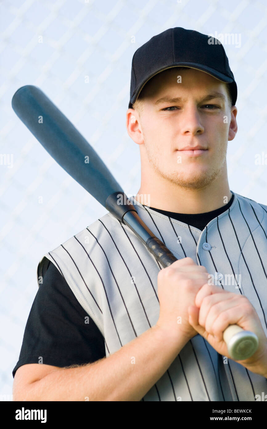 Portrait of a man holding a baseball bat Stock Photo Alamy