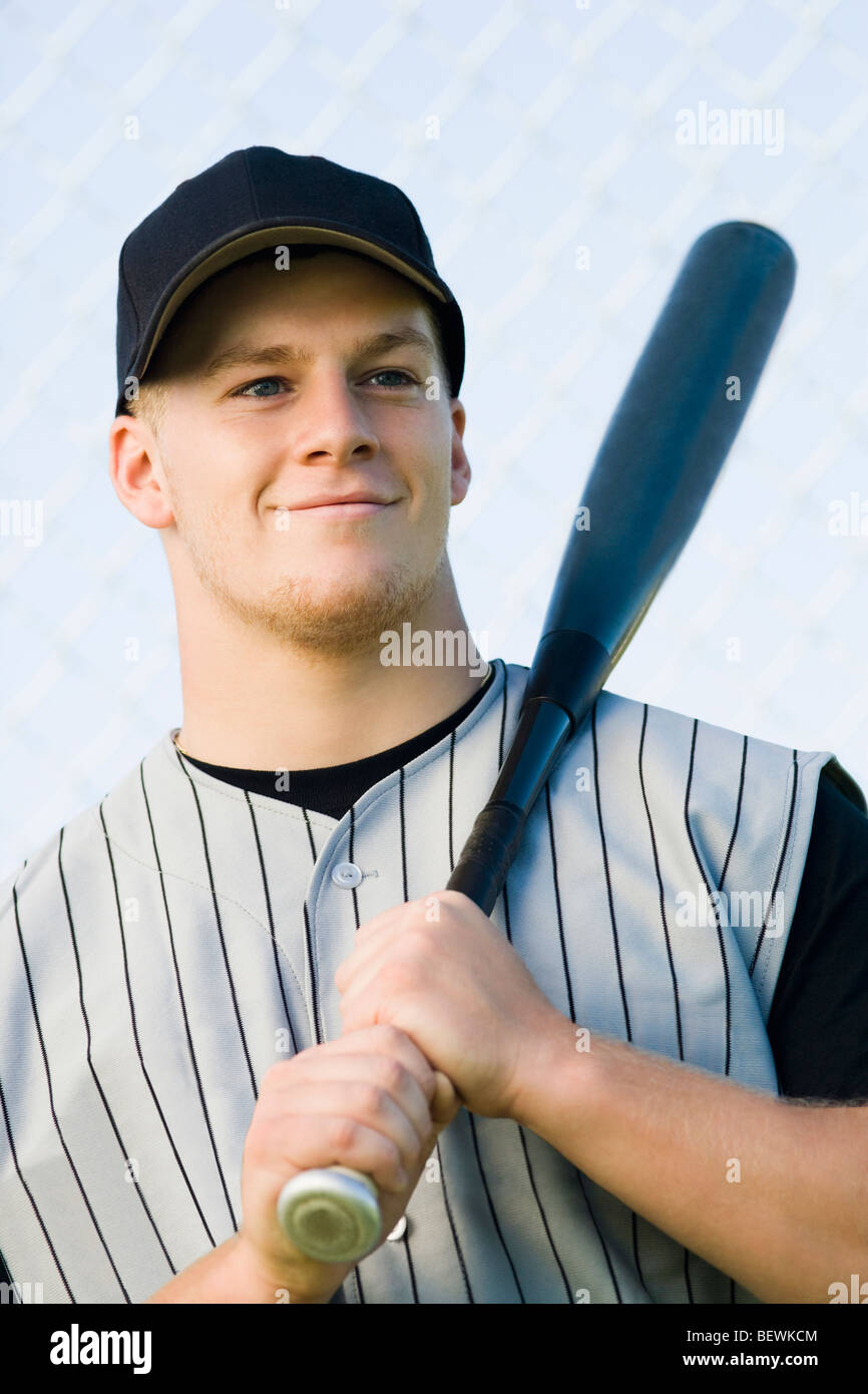 Baseball player holding bat hires stock photography and images Alamy