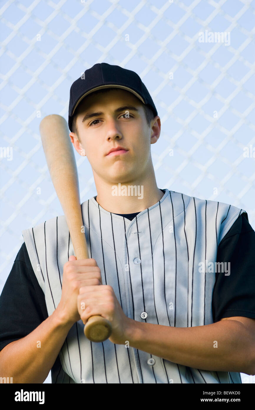 Portrait of a teenage boy holding a baseball bat Stock Photo Alamy