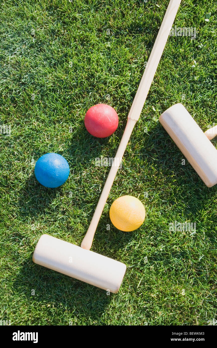 Close-up of two polo mallets with balls Stock Photo - Alamy