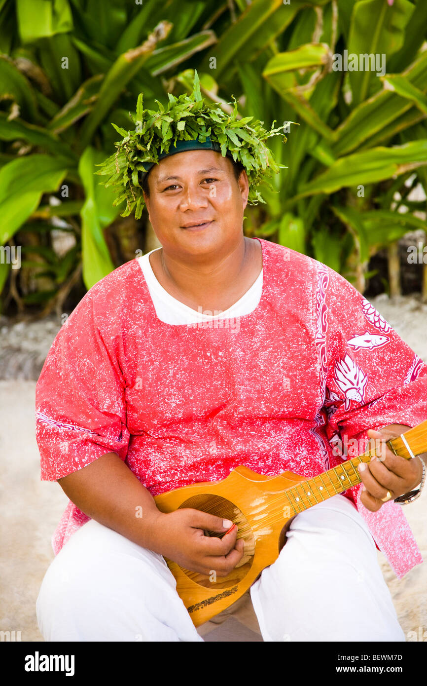 Portrait of a man playing a mandolin, Tahaa, Tahiti, French Polynesia